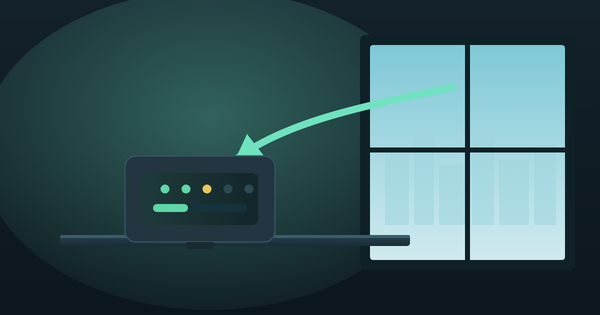 A small desktop CO2 monitor on a windowsill showing a parts-per-million reading, with a curved arrow indicating fresh air entering through the open window behind it.